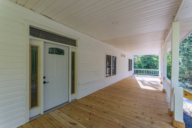 a view of a house with porch and wooden floor