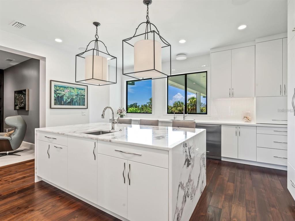 1245 Mill Creek Road Bradenton, FL 34212 - Photo 13 of 56 a kitchen with a sink stove and cabinets