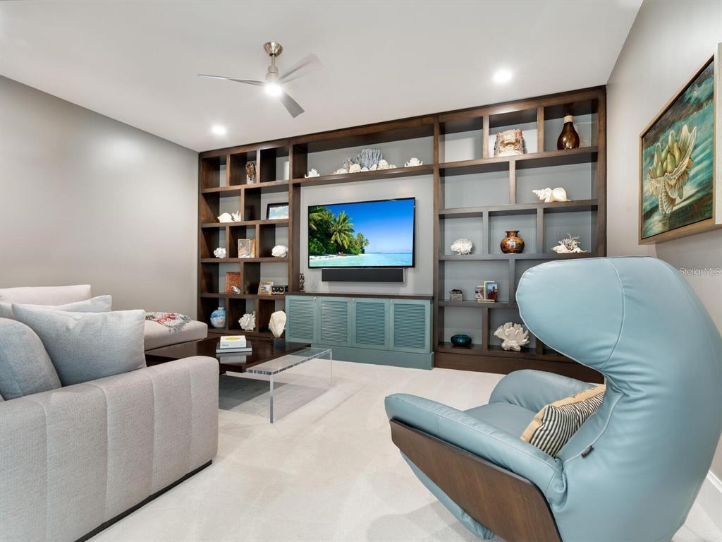 1245 Mill Creek Road Bradenton, FL 34212 - Photo 15 of 56 a living room with furniture workspace and a flat screen tv