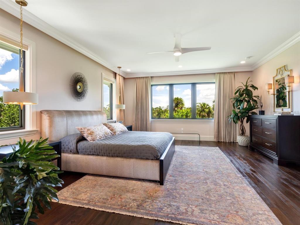 1245 Mill Creek Road Bradenton, FL 34212 - Photo 16 of 56 a living room with a balcony a bed and a couch