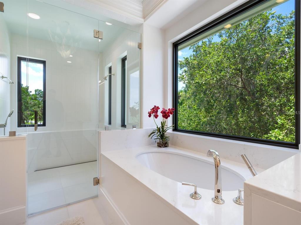 1245 Mill Creek Road Bradenton, FL 34212 - Photo 18 of 56 a bathroom with a bathtub and sink