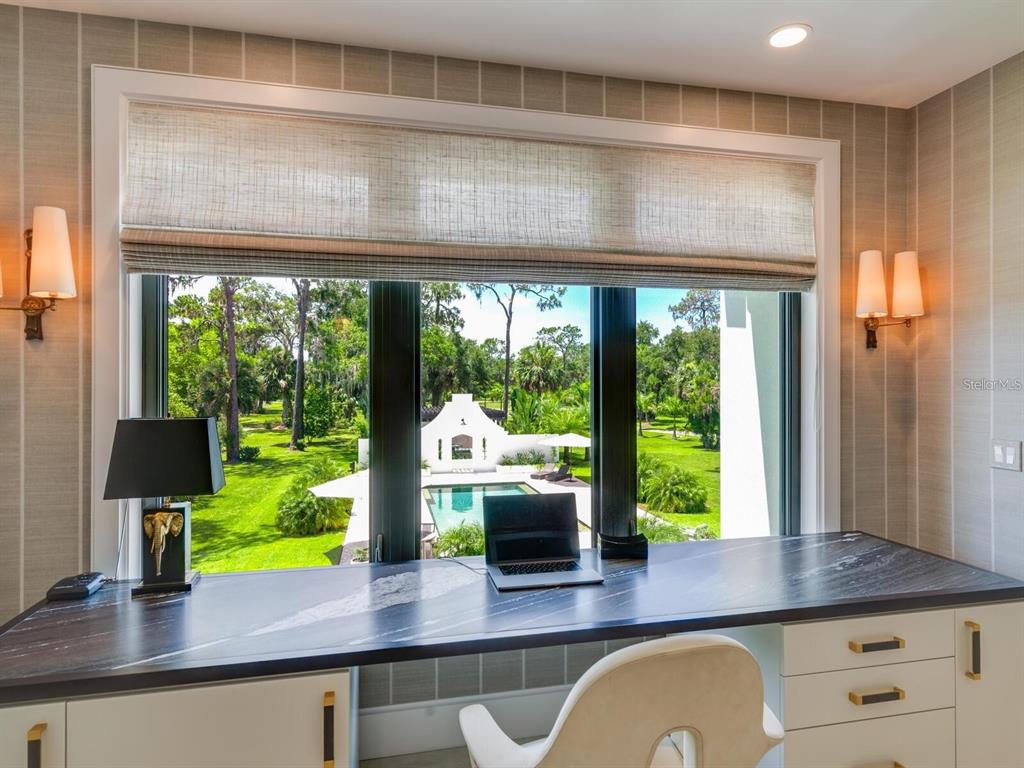 1245 Mill Creek Road Bradenton, FL 34212 - Photo 24 of 56 a kitchen with a large window in it