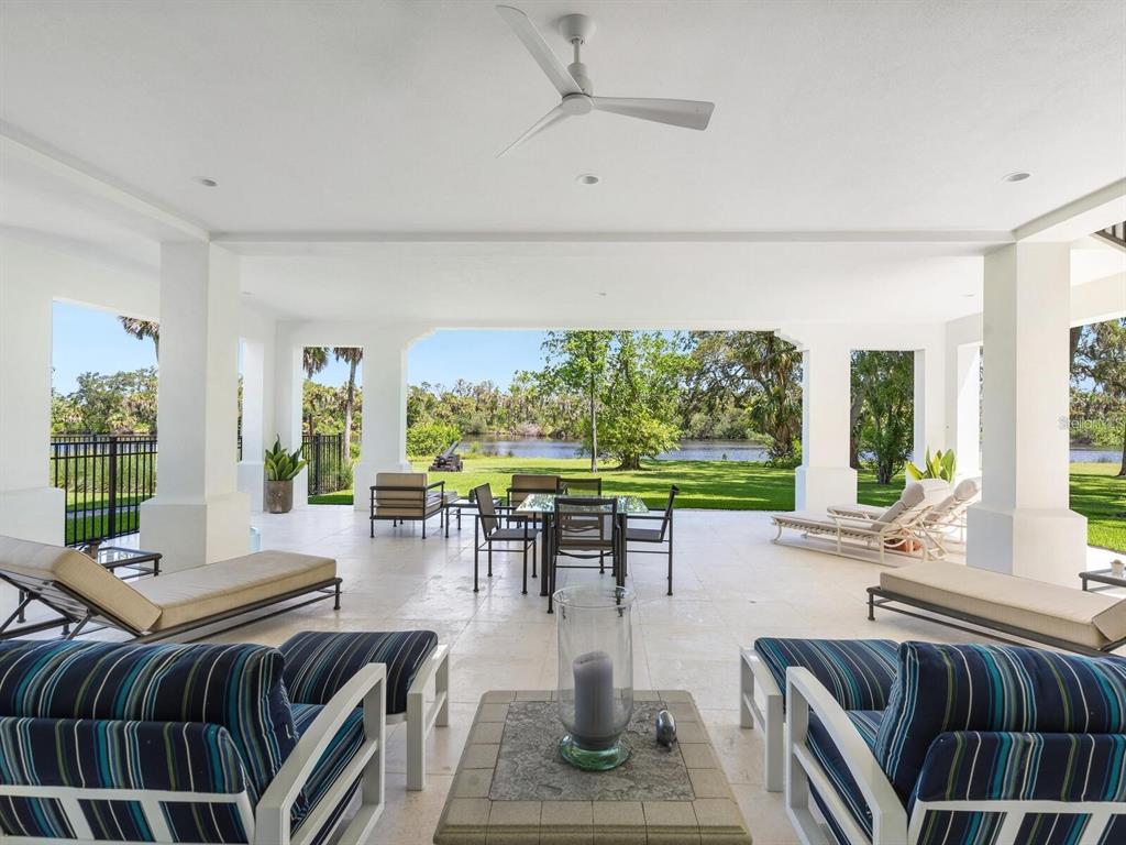 1245 Mill Creek Road Bradenton, FL 34212 - Photo 26 of 56 a living room with furniture and a large window