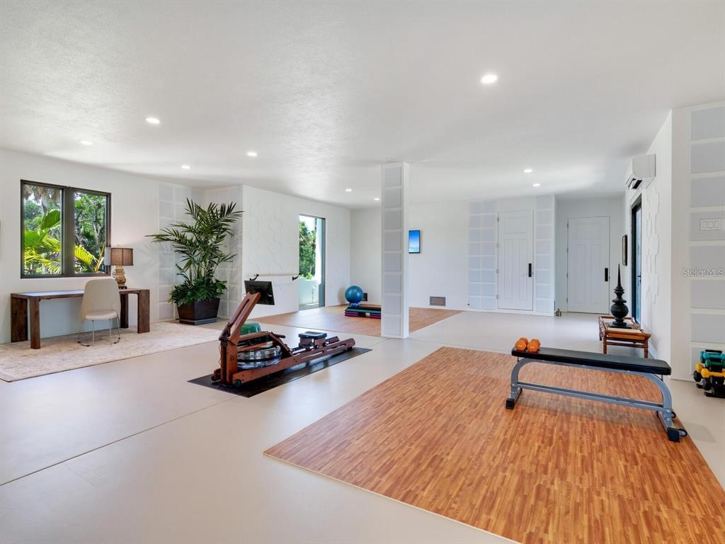 1245 Mill Creek Road Bradenton, FL 34212 - Photo 28 of 56 a living room with furniture and a wooden floor