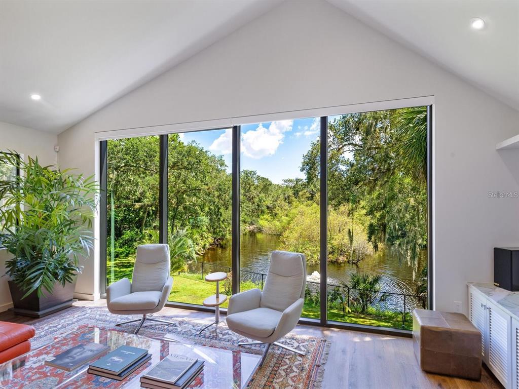 1245 Mill Creek Road Bradenton, FL 34212 - Photo 40 of 56 a living room with furniture and garden view