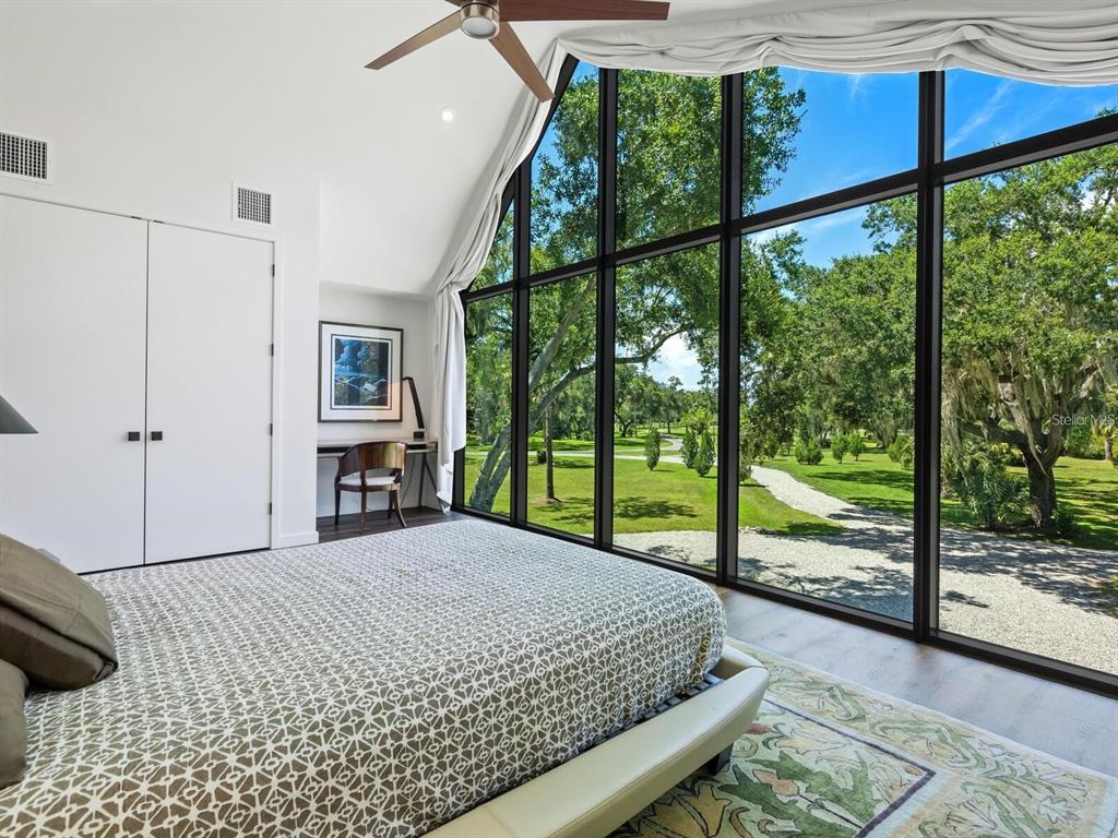 1245 Mill Creek Road Bradenton, FL 34212 - Photo 43 of 56 a bedroom with a bed and a view of balcony