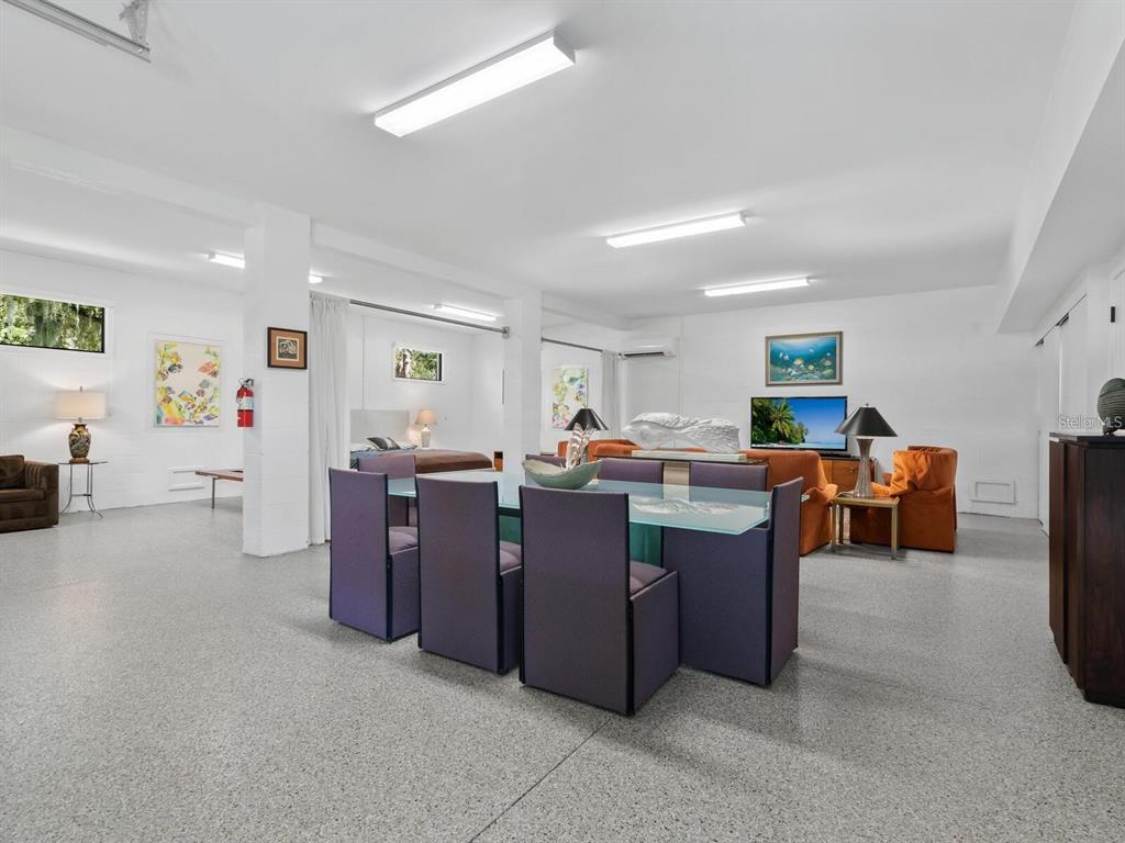 1245 Mill Creek Road Bradenton, FL 34212 - Photo 45 of 56 a living room with lots of furniture and clutter