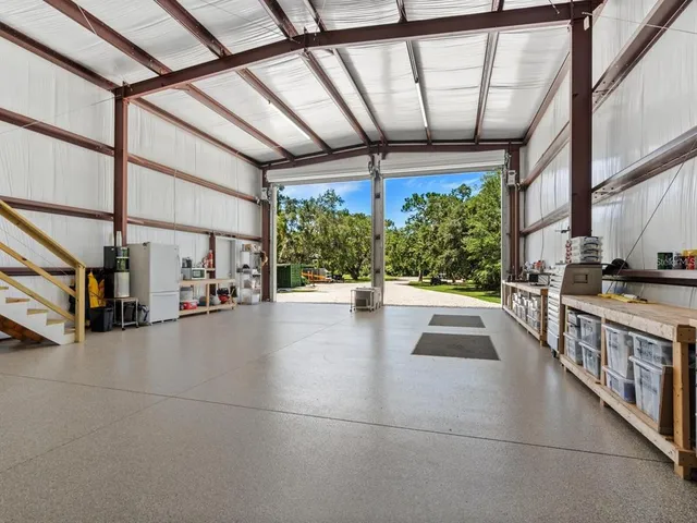 an aerial view of a house with a lake view