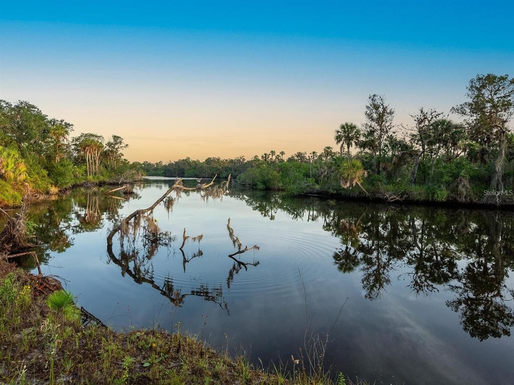 1245 Mill Creek Road Bradenton, FL 34212 - Photo 55 of 56 an aerial view of a house with a lake view