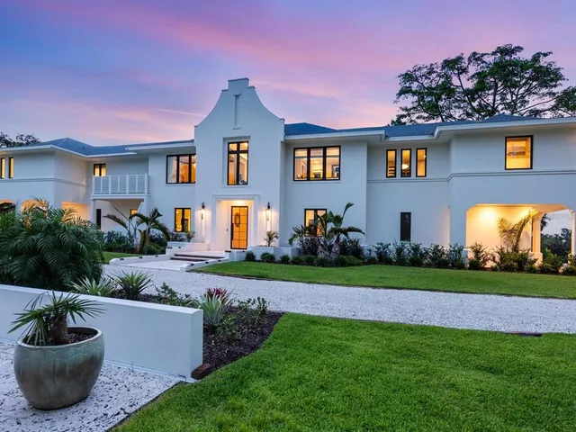 a view of a city with lush green forest