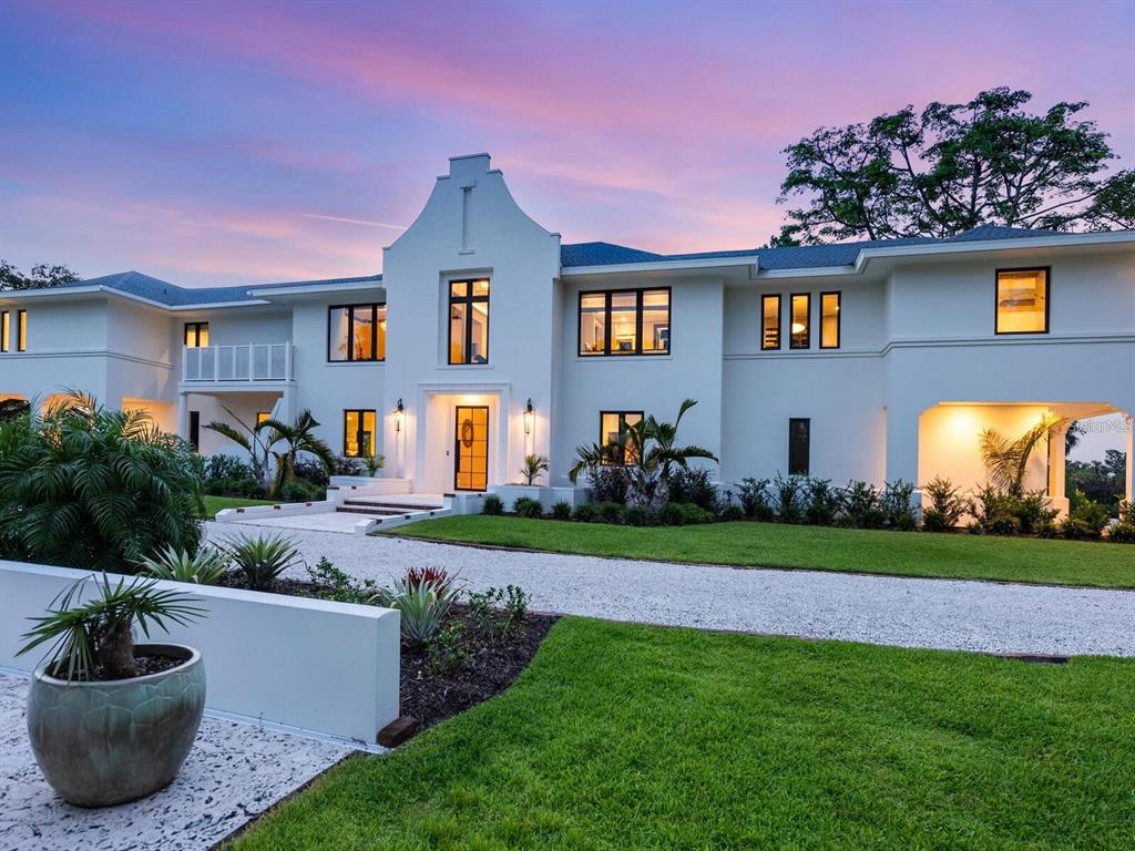 1245 Mill Creek Road Bradenton, FL 34212 - Photo 6 of 56 a front view of a house with garden