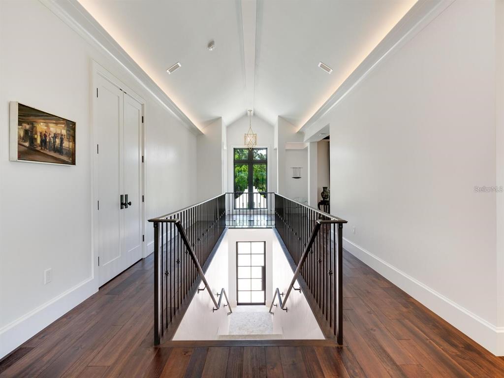 1245 Mill Creek Road Bradenton, FL 34212 - Photo 9 of 56 a view of entryway with wooden floor and stairs