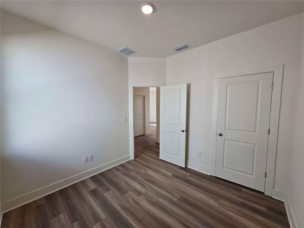 3841 Daybreak Run Loop Spring Hill, FL 34609 - Photo 7 of 11 a view of an empty room with closet and a window