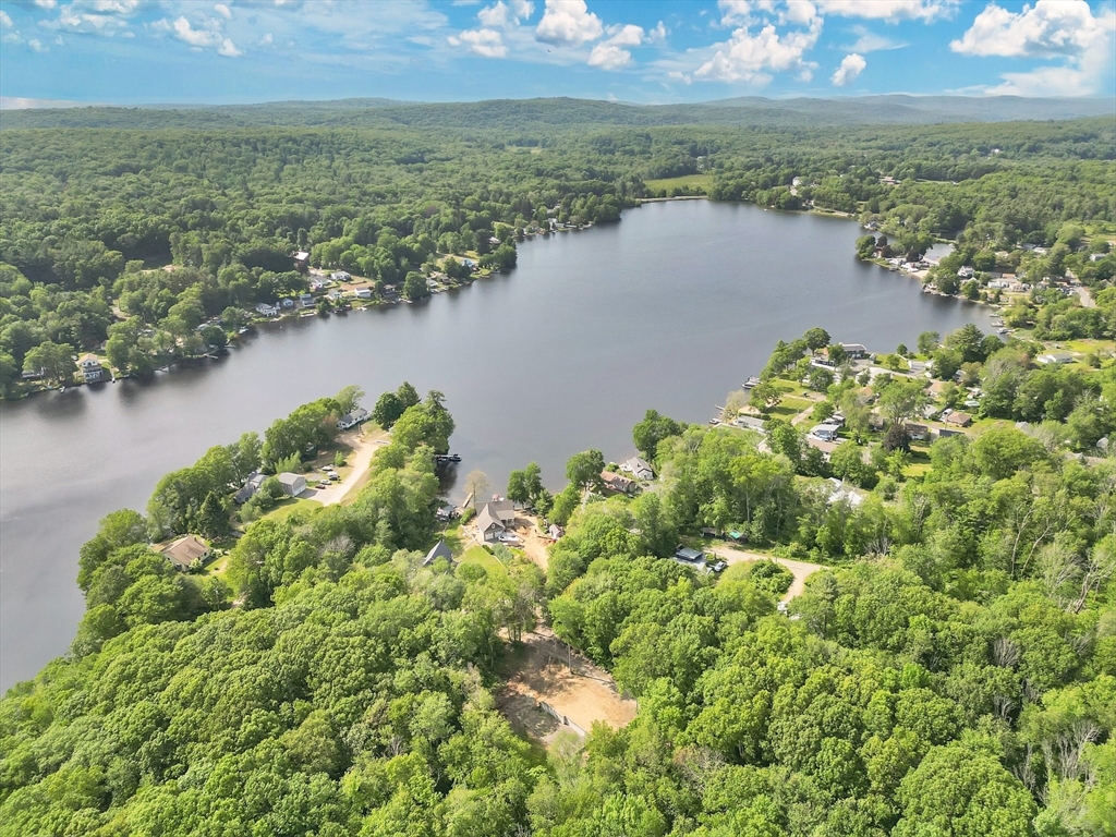 50 Fountain Road Wales, MA 01081 - Photo 1 of 20 an aerial view of residential houses with outdoor space and lake view