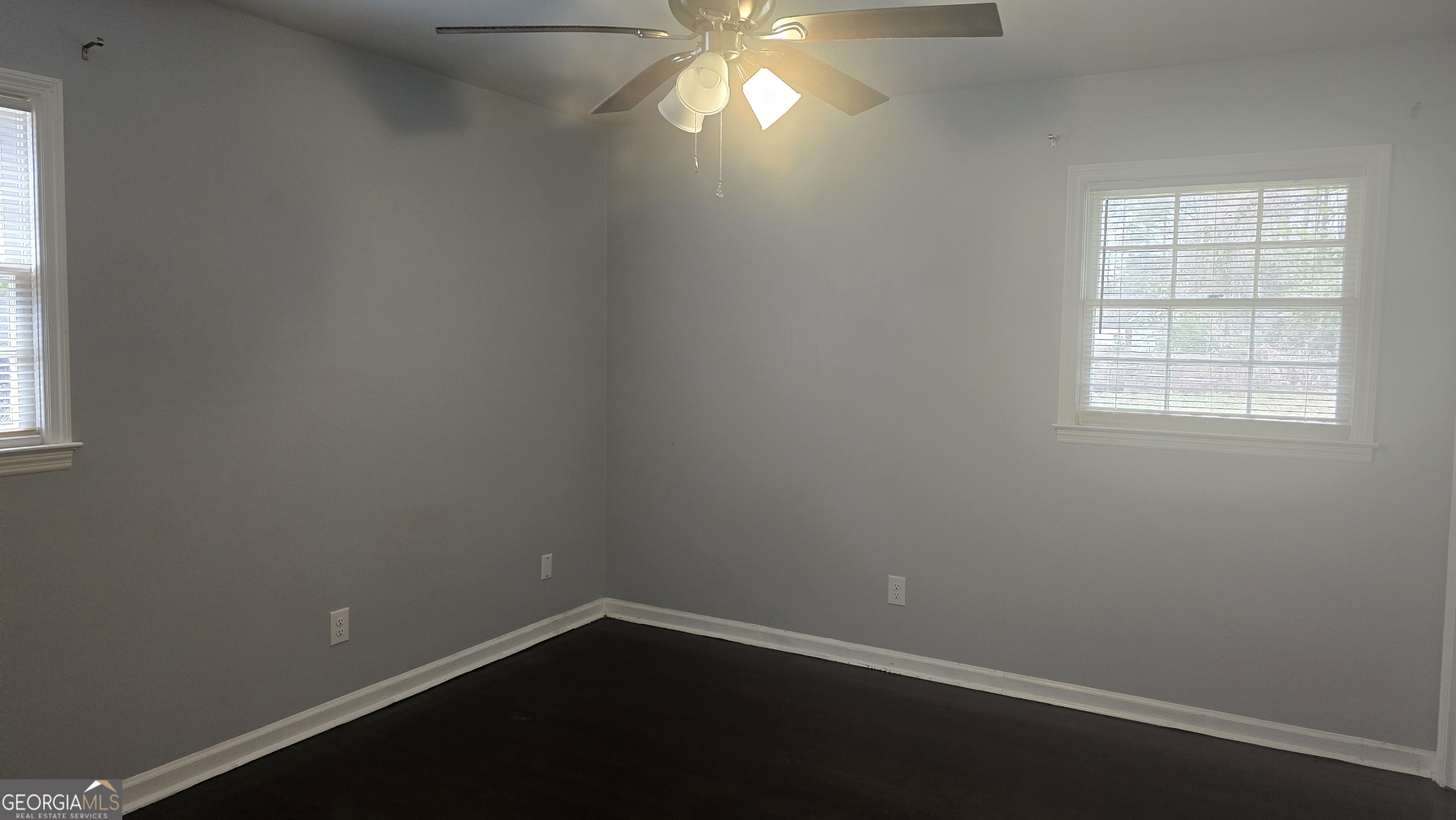 6359 Lanier Road Morrow, GA 30260 - Photo 13 of 15 an empty room with a window and a fan