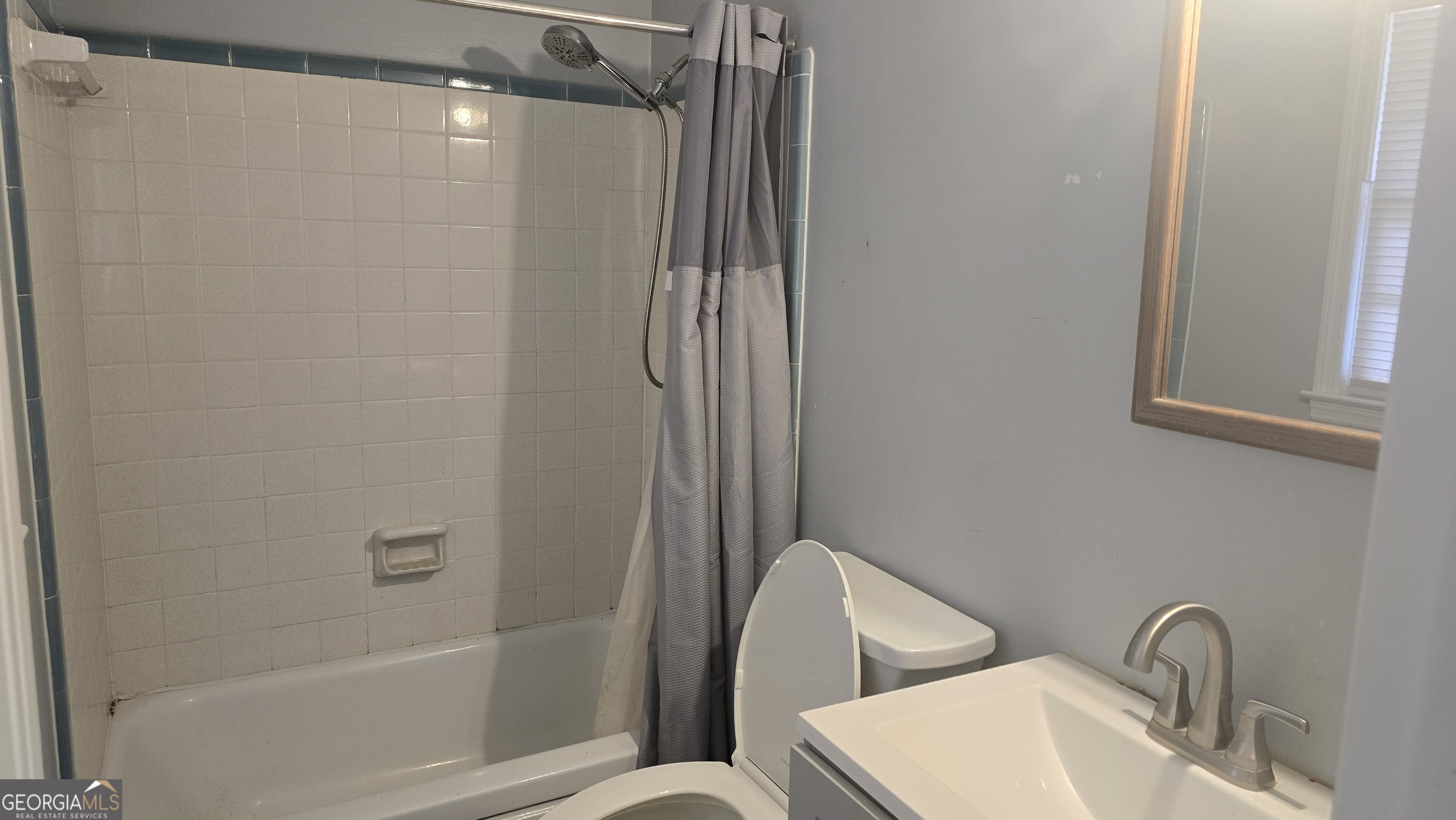 6359 Lanier Road Morrow, GA 30260 - Photo 14 of 15 a bathroom with a shower and a toilet