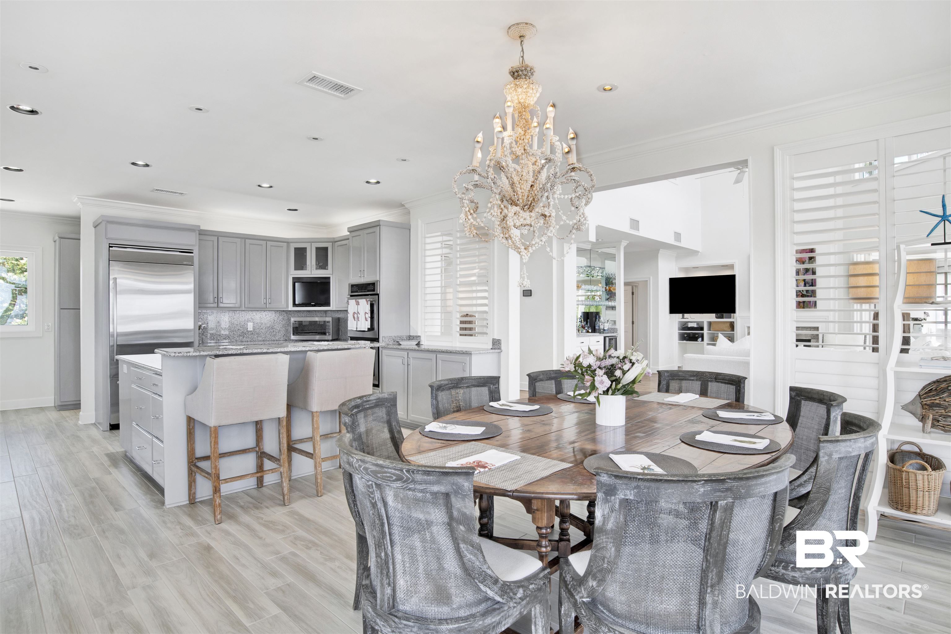 33400 River Road Orange Beach, AL 36561 - Photo 27 of 72 Dining space with an inviting chandelier, crown molding, and light wood-type flooring