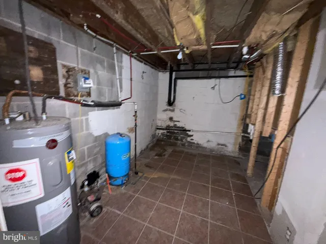 a bathroom with a granite countertop shower a vanity and a toilet