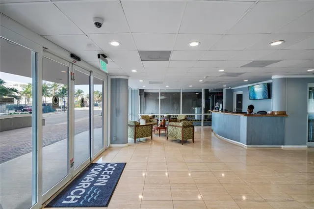 a view of kitchen with dining area and glass door