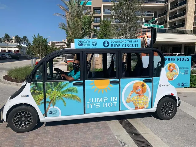 a view of a swimming pool with outdoor seating and plants