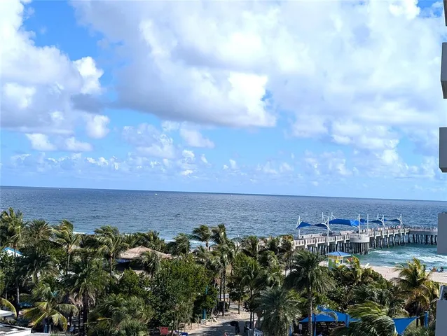 a view of a lake in middle of forest