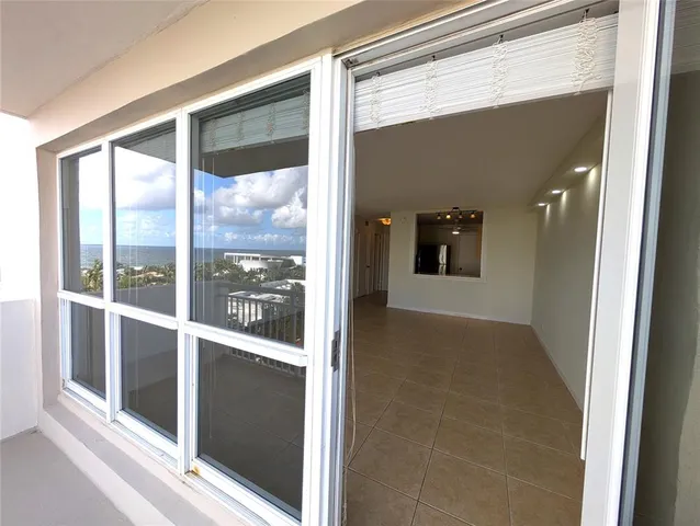 a view of a glass door of the house