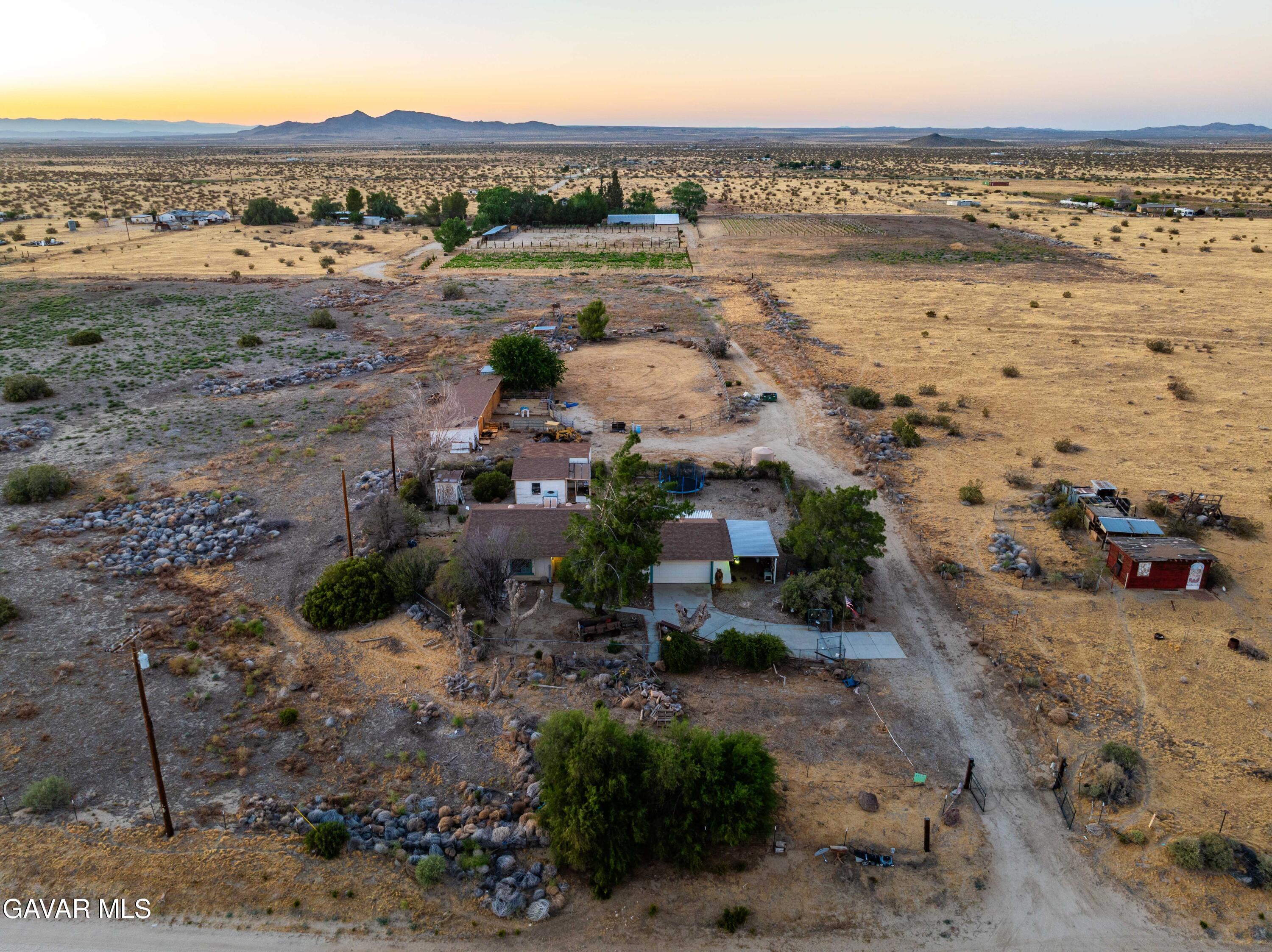 20539 East Ave R Palmdale, CA 93591 - Photo 3 of 55 a view of a lake with beach and city view