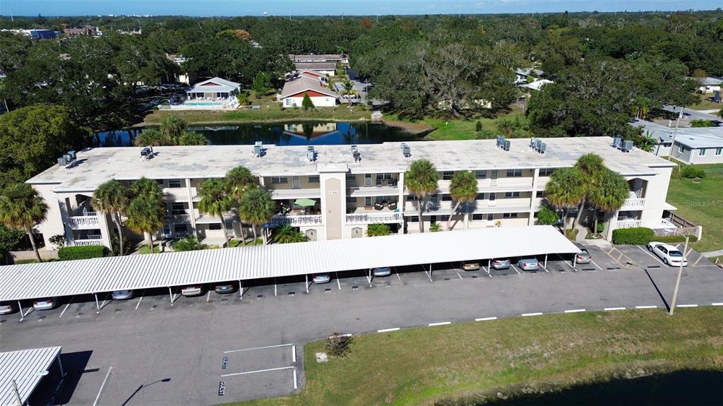 936 Virginia Street, Unit 206 Dunedin, FL 34698 - Photo 1 of 22 a view of a swimming pool with outdoor seating