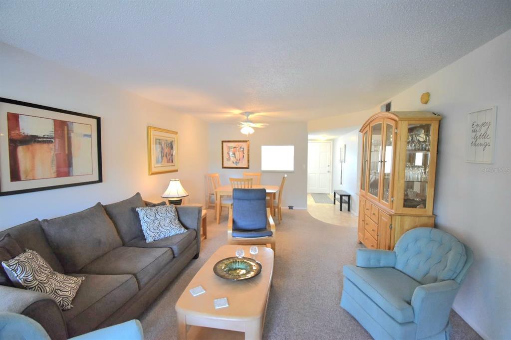 936 Virginia Street, Unit 206 Dunedin, FL 34698 - Photo 13 of 22 a living room with furniture and wooden floor