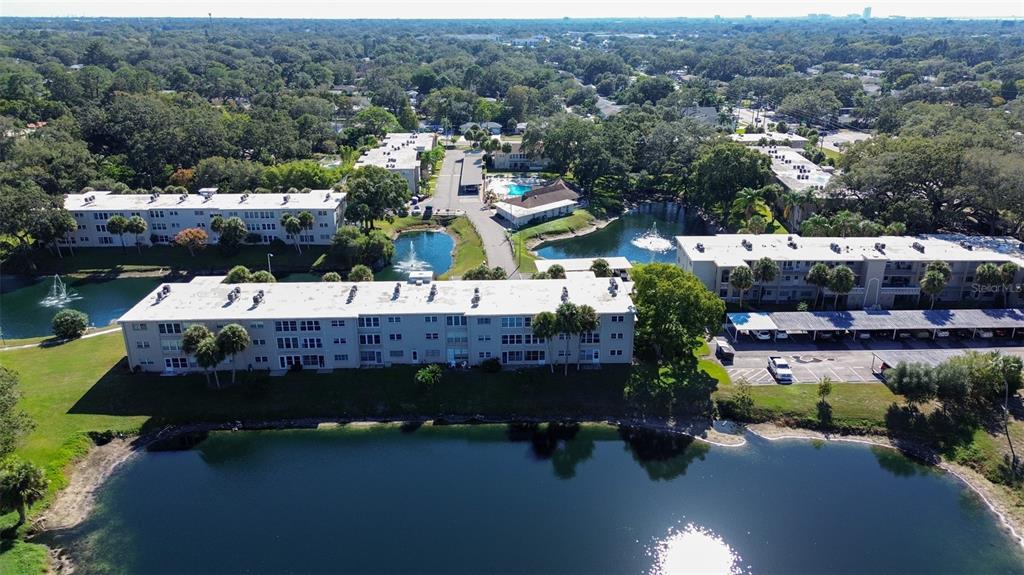 936 Virginia Street, Unit 206 Dunedin, FL 34698 - Photo 2 of 22 an aerial view of a house with garden space and street view
