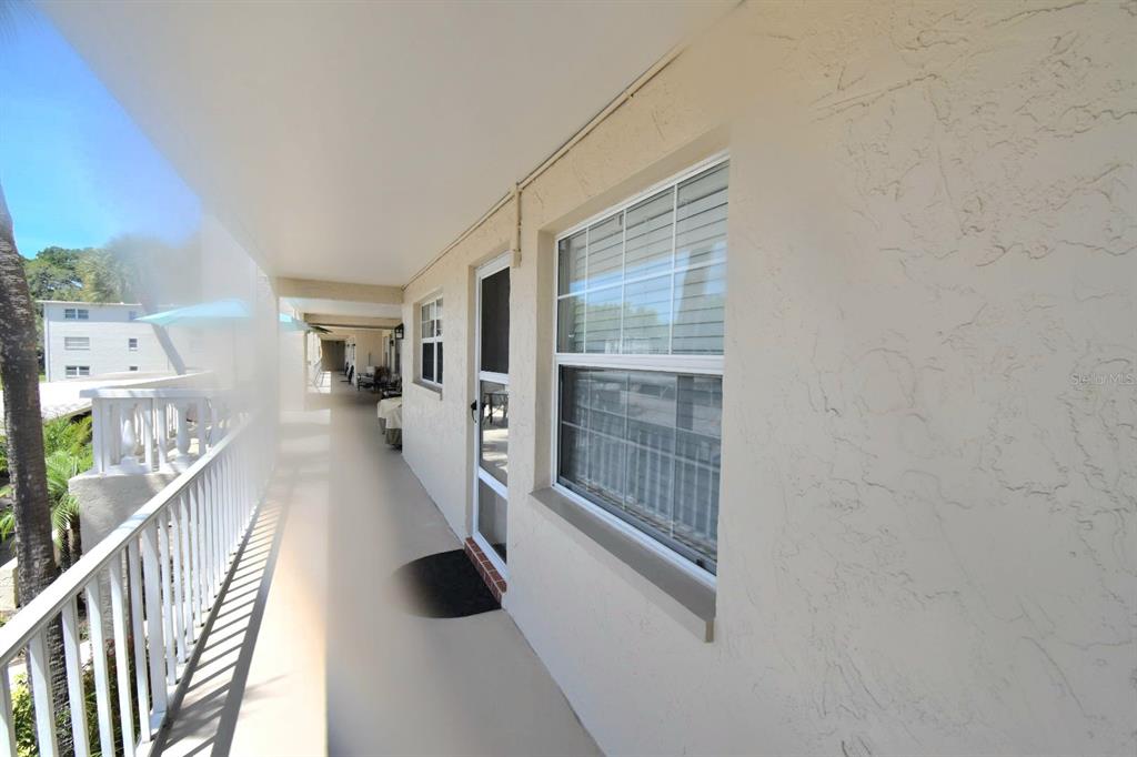 936 Virginia Street, Unit 206 Dunedin, FL 34698 - Photo 4 of 22 a view of entryway and hall with wooden floor