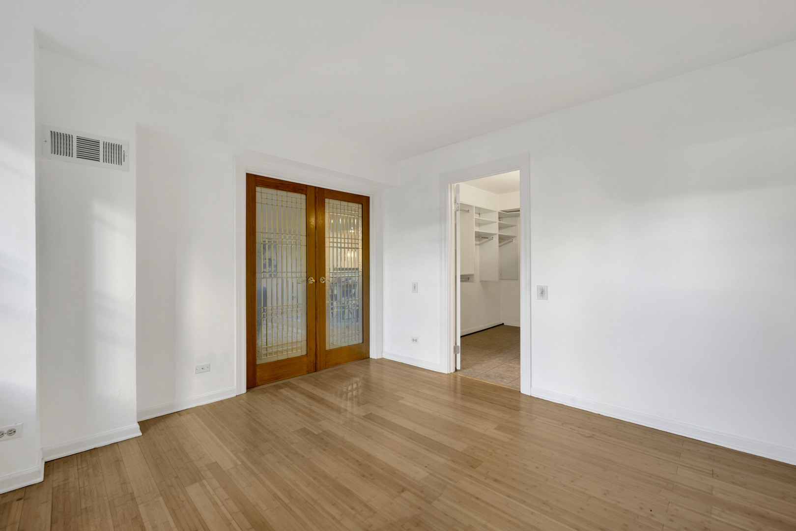 40 East 9th Street, Unit 609 Chicago, IL 60605 - Photo 20 of 37 a view of an empty room with wooden floor and closet