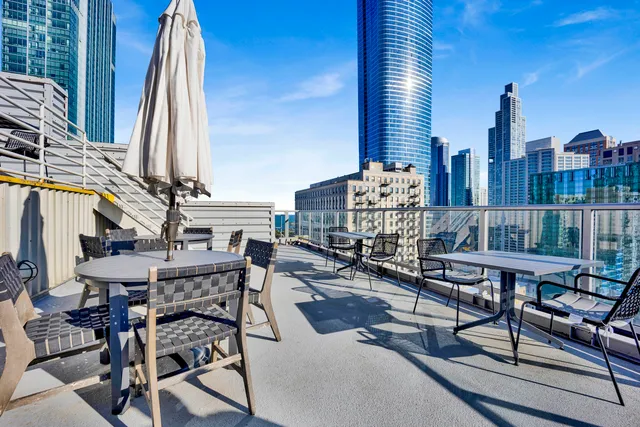a view of a balcony with chairs