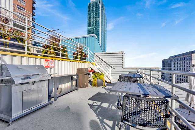 a view of a balcony with outdoor seating