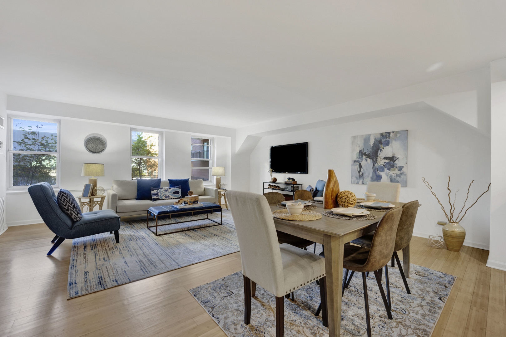 40 East 9th Street, Unit 609 Chicago, IL 60605 - Photo 6 of 37 a living room with furniture and a flat screen tv