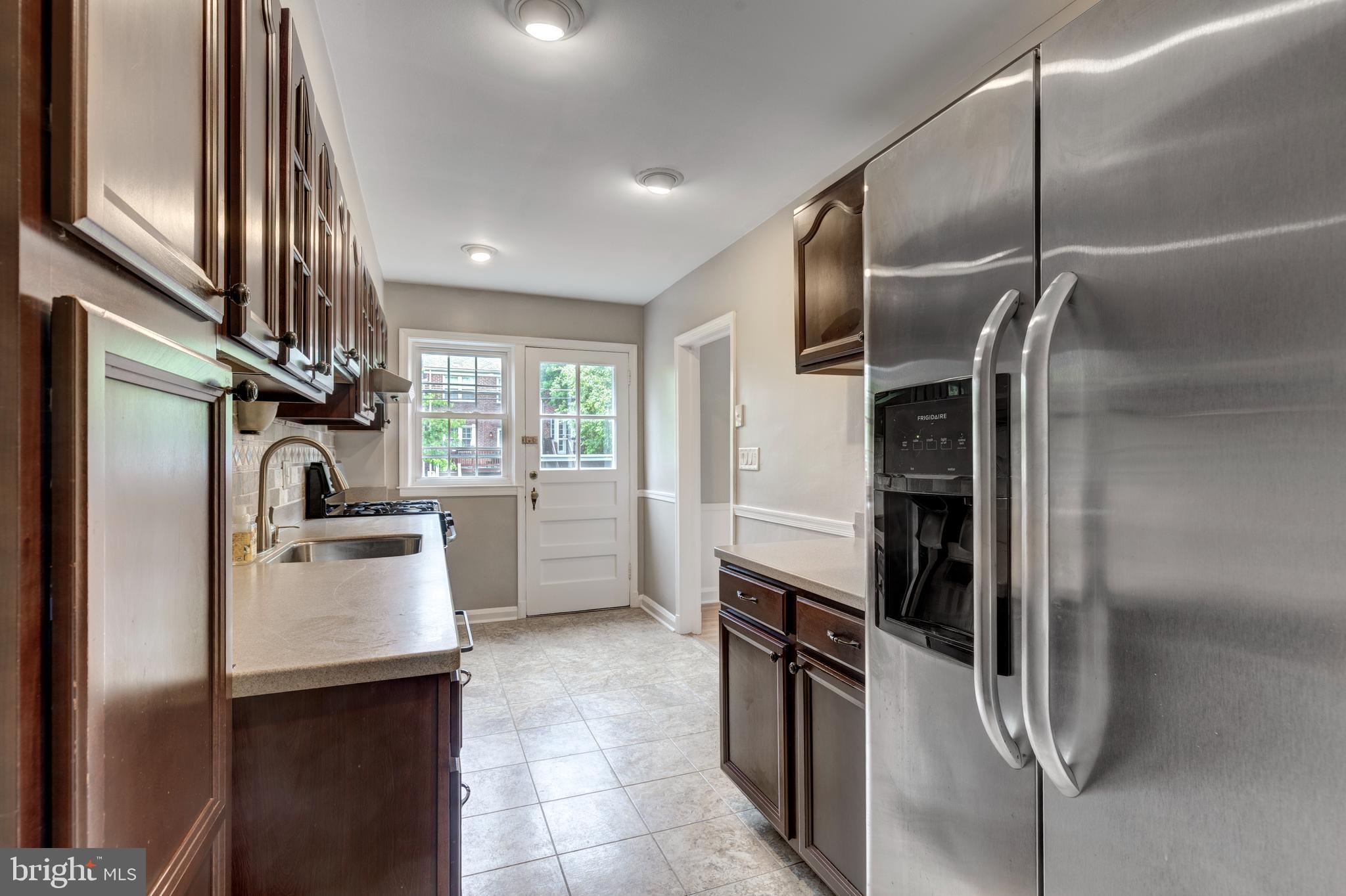 202 Brandon Road Baltimore, MD 21212 - Photo 6 of 42 a kitchen with stainless steel appliances granite countertop a refrigerator and a sink