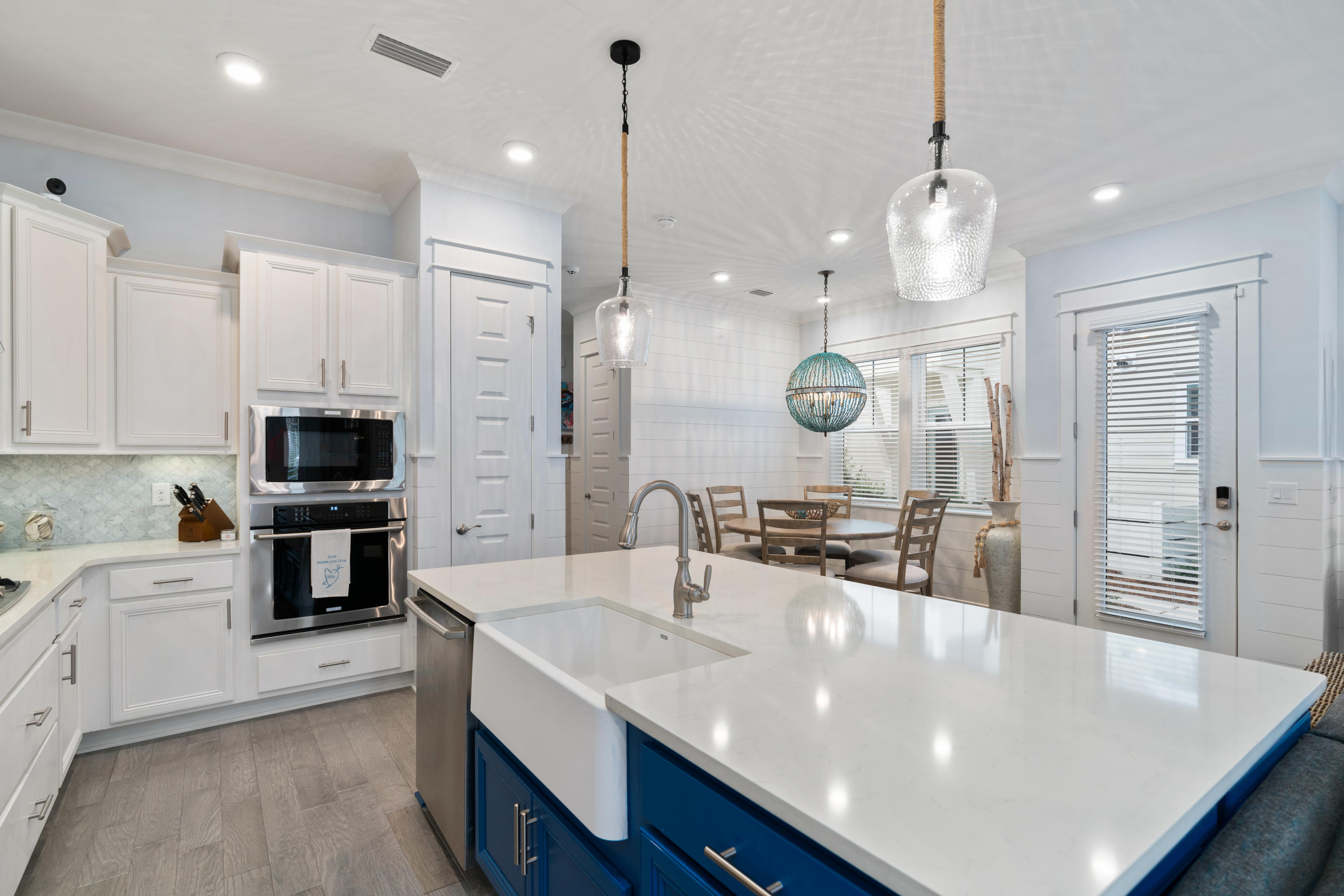 282 East Milestone Dr Inlet Beach, Unit A Inlet Beach, FL 32461 - Photo 1 of 26 a large kitchen with stainless steel appliances a large center island attached withe living room