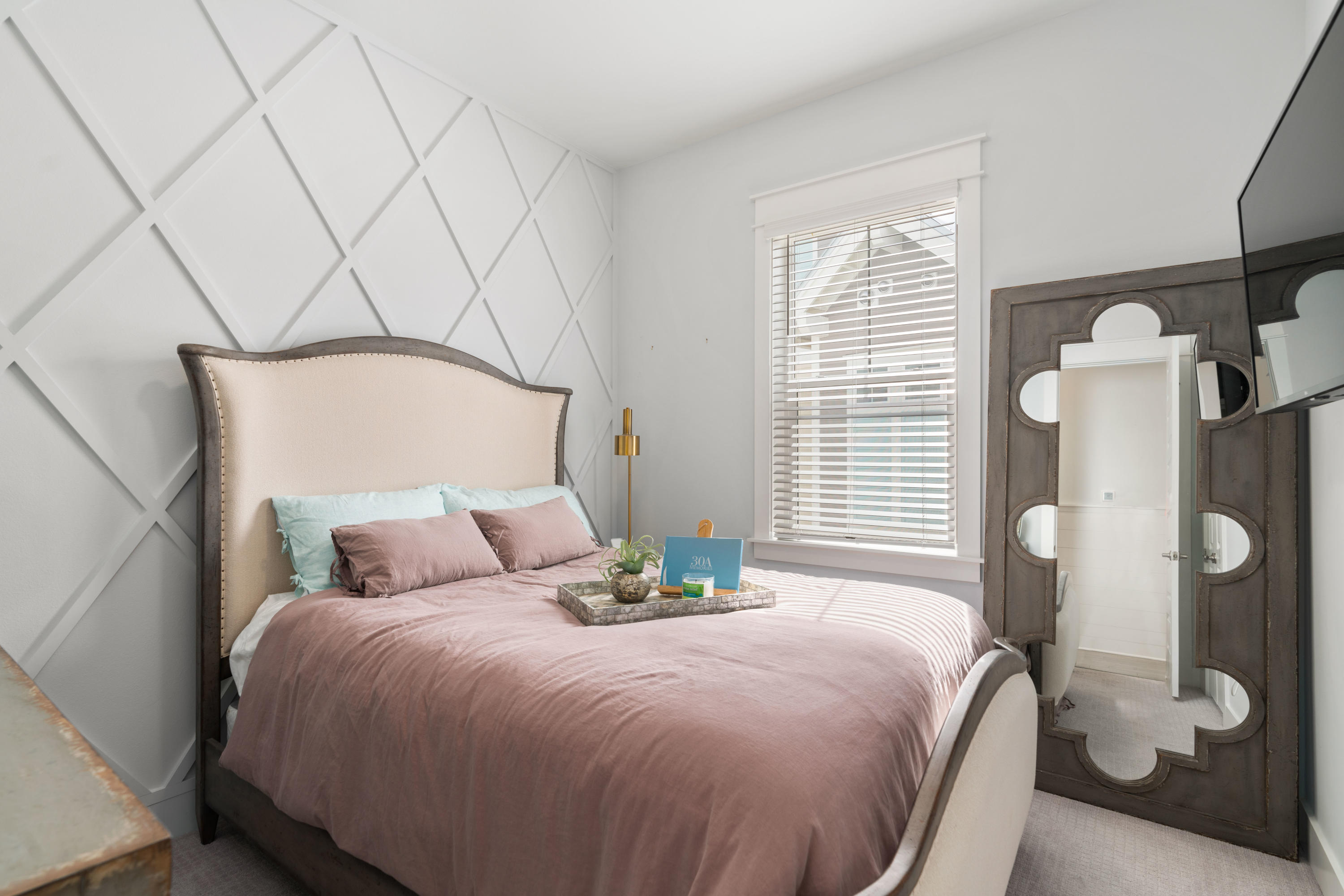 282 East Milestone Dr Inlet Beach, Unit A Inlet Beach, FL 32461 - Photo 18 of 26 a bedroom with a bed and wooden floor