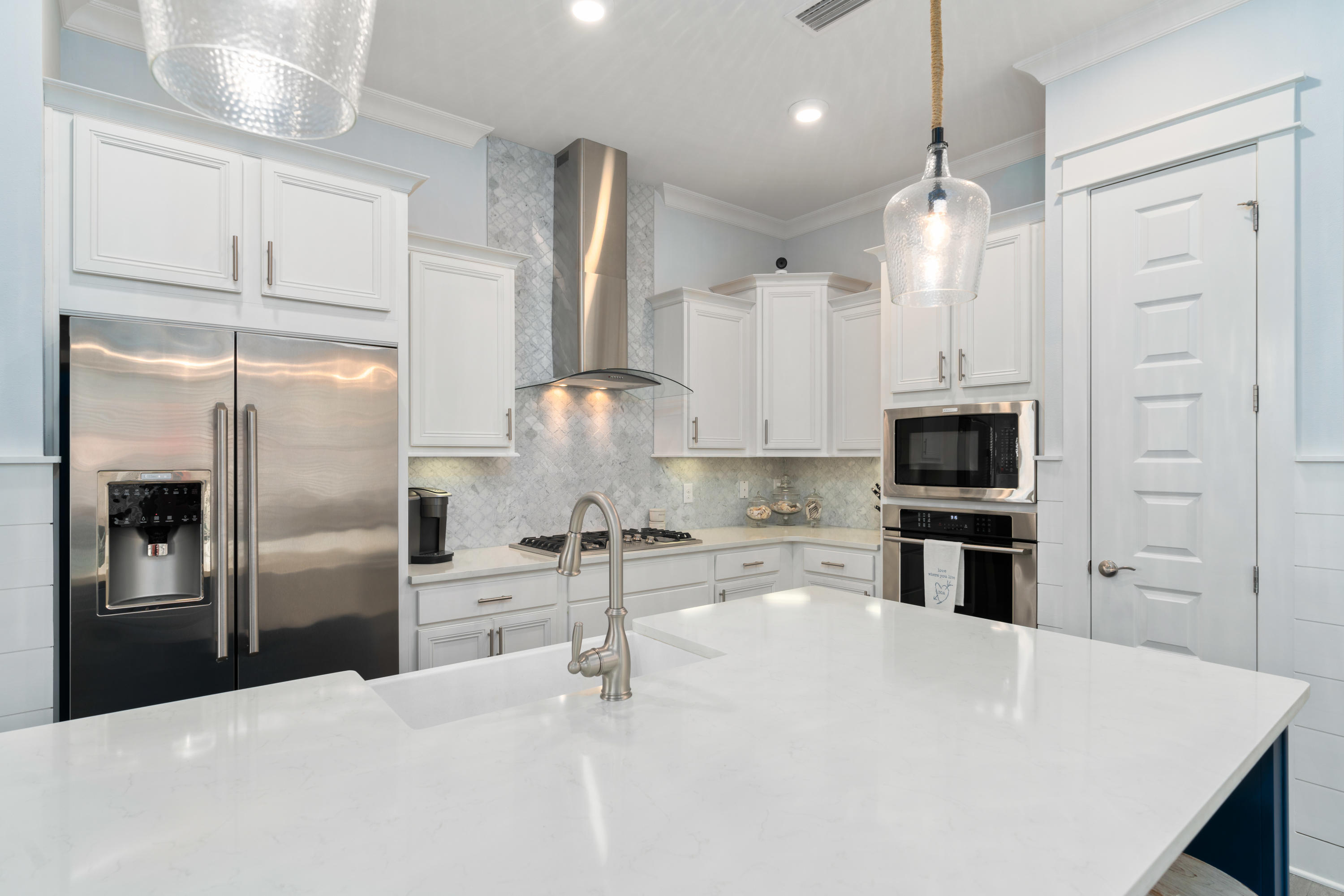 282 East Milestone Dr Inlet Beach, Unit A Inlet Beach, FL 32461 - Photo 3 of 26 a kitchen with stainless steel appliances a refrigerator sink and microwave