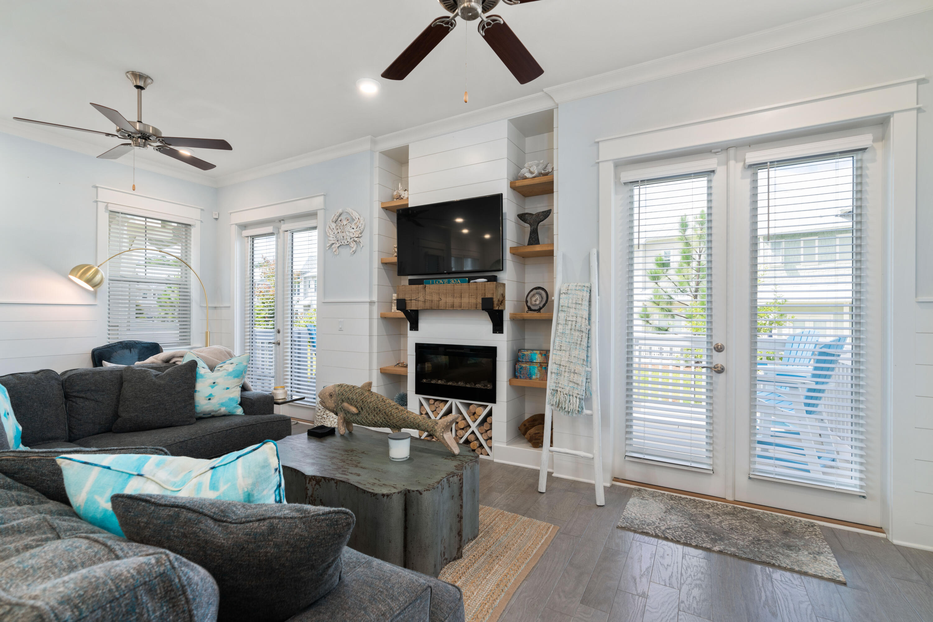 282 East Milestone Dr Inlet Beach, Unit A Inlet Beach, FL 32461 - Photo 7 of 26 a living room with furniture a fireplace and a flat screen tv