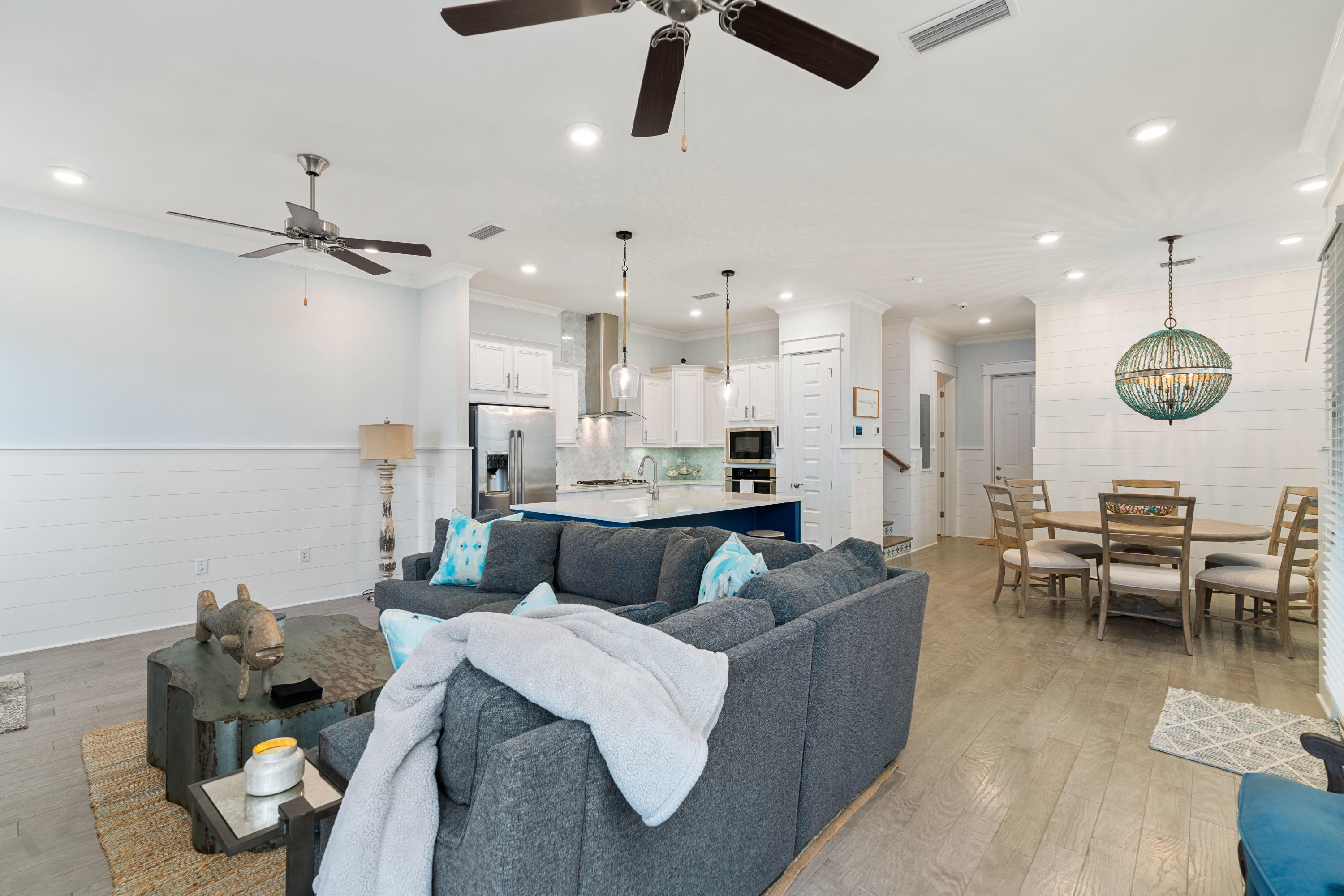 282 East Milestone Dr Inlet Beach, Unit A Inlet Beach, FL 32461 - Photo 10 of 26 a living room with furniture kitchen view and a chandelier