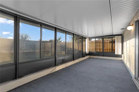 a view of an empty room with a sliding door