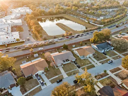an aerial view of a building with parking