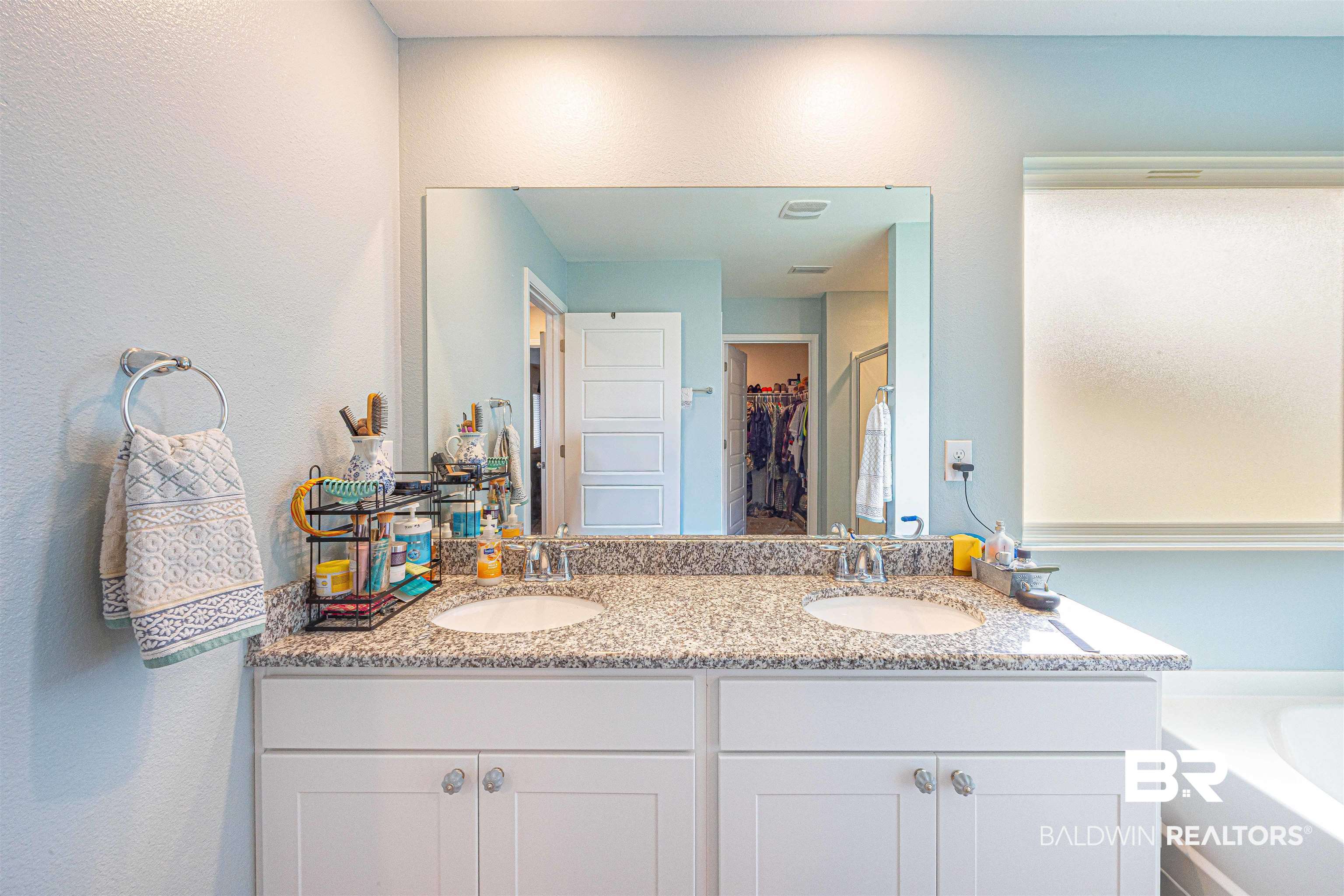 14843 Forsythia Loop Silverhill, AL 36576 - Photo 26 of 51 Full bath featuring double vanity, a bath, a walk in closet, and a stall shower