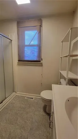 a bathroom with a toilet and a sink