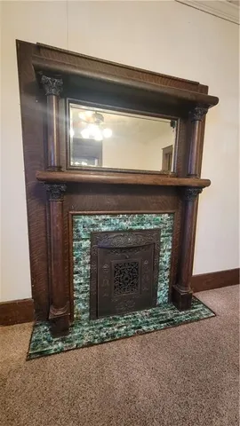 a fireplace with a clock on top