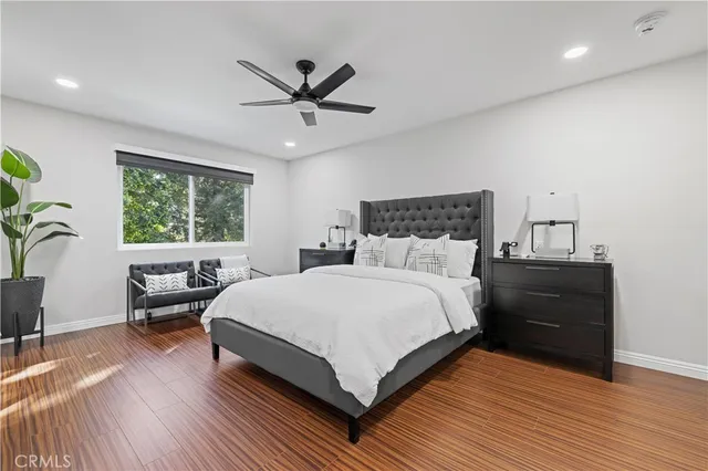 a bedroom with a large bed and a window