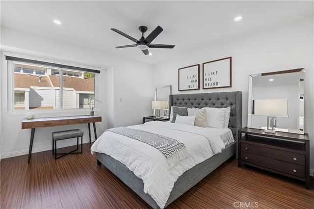 a bedroom with a bed and a table