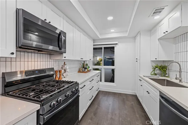 a kitchen with a stove and a microwave