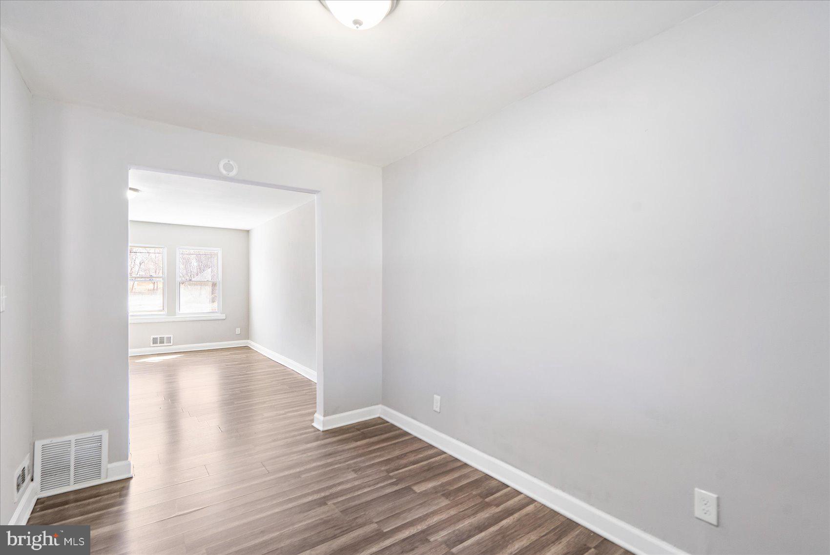 706 Norris Lane Baltimore, MD 21221 - Photo 16 of 36 a view of an empty room with wooden floor